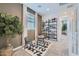 Upstairs hallway with decorative shelving, accent wall, and bright, natural light at 3303 S Lotus St, Mesa, AZ 85212