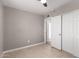 Bedroom with tile floors, neutral walls, and a double door closet at 346 S Florence St, Casa Grande, AZ 85122