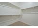 Walk-in closet with shelving and rod storage, offering plenty of space for organizing clothes and accessories at 35231 N Danburite Ct, San Tan Valley, AZ 85144