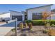 Landscaped front yard featuring desert landscaping and a modern home exterior at 35231 N Danburite Ct, San Tan Valley, AZ 85144