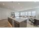 Spacious kitchen island offering ample counter space and views of the bright open living area at 35231 N Danburite Ct, San Tan Valley, AZ 85144