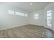 Bright living room features wood-look floors and ample natural light at 35231 N Danburite Ct, San Tan Valley, AZ 85144