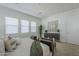 Bright main bedroom showcases a calming color palette, comfortable seating, and plenty of natural light at 35231 N Danburite Ct, San Tan Valley, AZ 85144