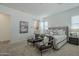 Spacious main bedroom features seating area, ensuite bathroom, and plenty of natural light at 35231 N Danburite Ct, San Tan Valley, AZ 85144