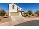 Lovely home with a well-maintained front yard, a two-car garage, and desert landscaping at 375 S Soledad Ln, Casa Grande, AZ 85194