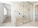 Modern bathroom featuring a glass shower with marble and mosaic tile, and neutral color palette at 40234 N Alegre Dr, San Tan Valley, AZ 85140