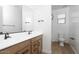 Bathroom with double vanity, modern faucets, and walk-in shower at 40234 N Alegre Dr, San Tan Valley, AZ 85140