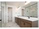 Modern bathroom with double sink vanity, large mirror, and separate shower at 40234 N Alegre Dr, San Tan Valley, AZ 85140