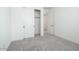 Bright bedroom with neutral carpeting and sliding closet doors at 40234 N Alegre Dr, San Tan Valley, AZ 85140