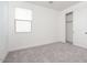 Bright bedroom with neutral carpeting, window and closet with sliding doors at 40234 N Alegre Dr, San Tan Valley, AZ 85140