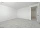 Bedroom features neutral carpet, white walls, and an open door at 40234 N Alegre Dr, San Tan Valley, AZ 85140