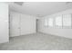 Bedroom features neutral carpet, white walls, and bright windows at 40234 N Alegre Dr, San Tan Valley, AZ 85140