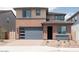 Charming two-story home with a modern garage door and neutral color palette at 40234 N Alegre Dr, San Tan Valley, AZ 85140