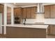 Modern kitchen with stainless steel appliances, white countertops, and a large center island at 40234 N Alegre Dr, San Tan Valley, AZ 85140