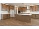 Spacious kitchen featuring wood cabinets, stainless steel appliances, and a large island at 40234 N Alegre Dr, San Tan Valley, AZ 85140