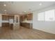 Spacious kitchen featuring wood cabinets, stainless steel appliances, and a large island at 40234 N Alegre Dr, San Tan Valley, AZ 85140