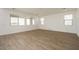 Bright and airy living room with tile floors and multiple windows for natural light at 40234 N Alegre Dr, San Tan Valley, AZ 85140