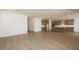 Open-concept living room and kitchen area with wood flooring and recessed lighting at 40234 N Alegre Dr, San Tan Valley, AZ 85140