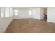 Spacious open floor plan living area with tile flooring, stairs, and ample natural light at 40234 N Alegre Dr, San Tan Valley, AZ 85140