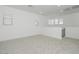 Upstairs loft area with neutral carpet, white walls, and lots of light at 40234 N Alegre Dr, San Tan Valley, AZ 85140