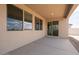 Covered patio with large windows and sliding glass door, offering a seamless transition to indoor living space at 40234 N Alegre Dr, San Tan Valley, AZ 85140