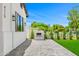 Inviting backyard featuring a modern fireplace and lush green landscaping at 4115 E Windsor Ave, Phoenix, AZ 85008
