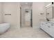 Luxurious bathroom with a soaking tub, tiled floors, and a separate shower at 4115 E Windsor Ave, Phoenix, AZ 85008
