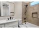 Modern bathroom featuring tiled walls, a large mirror, and a bathtub at 4115 E Windsor Ave, Phoenix, AZ 85008