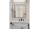 Stylish bathroom features a large framed mirror, sleek fixtures, and a bright vanity at 4115 E Windsor Ave, Phoenix, AZ 85008