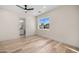 Bedroom featuring neutral walls, hardwood flooring, natural light, and en suite bathroom at 4115 E Windsor Ave, Phoenix, AZ 85008