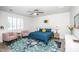 Cozy bedroom with vibrant rug, stylish furniture, and bright natural lighting at 4115 E Windsor Ave, Phoenix, AZ 85008