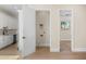 Open concept floor plan showcases natural wood floors, leading to the kitchen and bedroom at 4115 E Windsor Ave, Phoenix, AZ 85008
