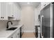 Modern kitchen with stainless steel appliances, sleek countertops and cabinets at 4115 E Windsor Ave, Phoenix, AZ 85008