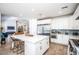 Bright kitchen with white cabinets, stainless steel appliances, and large center island at 4115 E Windsor Ave, Phoenix, AZ 85008