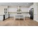 Spacious kitchen showcasing white cabinets, stainless steel appliances, and a large center island at 4115 E Windsor Ave, Phoenix, AZ 85008