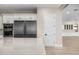Well-equipped kitchen featuring stainless steel refrigerator, modern appliances, and ample counter space at 4115 E Windsor Ave, Phoenix, AZ 85008