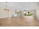 Expansive living area with hardwood floors, fireplace, built-in cabinets, and access to the backyard through sliding doors at 4115 E Windsor Ave, Phoenix, AZ 85008