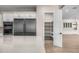 Well-equipped kitchen featuring stainless steel refrigerator and a walk-in pantry with shelving at 4115 E Windsor Ave, Phoenix, AZ 85008