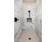 Beautiful shower with marble-look tile, a built-in niche, and modern fixtures at 4115 E Windsor Ave, Phoenix, AZ 85008