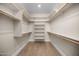 Organized walk-in closet with shelving and racks for optimal storage at 4115 E Windsor Ave, Phoenix, AZ 85008