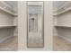 Spacious walk-in closet with built-in shelving and ample storage space at 4115 E Windsor Ave, Phoenix, AZ 85008