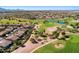Expansive aerial view showcasing the community's golf course, lush landscaping, and residential homes at 4674 E Alfalfa Dr, Gilbert, AZ 85298