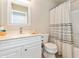 Bathroom with white vanity and patterned shower curtain at 4674 E Alfalfa Dr, Gilbert, AZ 85298