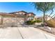 Inviting single-story home featuring a two-car garage, desert landscaping, and a terracotta-tiled roof at 4674 E Alfalfa Dr, Gilbert, AZ 85298