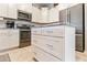 Kitchen island with granite countertop, stainless steel appliances, and white cabinets at 4674 E Alfalfa Dr, Gilbert, AZ 85298