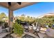 Cozy outdoor patio area with comfortable seating and manicured landscaping at 4674 E Alfalfa Dr, Gilbert, AZ 85298