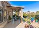 Spacious covered patio with potted plants and outdoor furniture at 4674 E Alfalfa Dr, Gilbert, AZ 85298