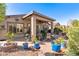 Beautiful covered patio featuring garden decor and comfortable seating at 4674 E Alfalfa Dr, Gilbert, AZ 85298