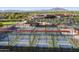 Aerial view featuring multiple pickleball courts surrounded by a community and mountain views at 4674 E Alfalfa Dr, Gilbert, AZ 85298