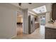 Open-concept kitchen with stainless steel appliances and a view into the adjacent living area at 4720 E Elena Ave, Mesa, AZ 85206